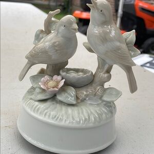 Porcelain Bird Figurine with Flower nesting and is a music box